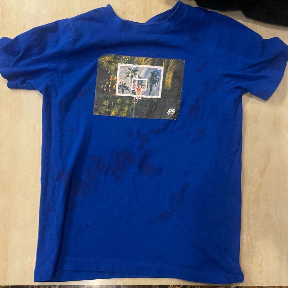 Blue “The Nike Tee” shirt